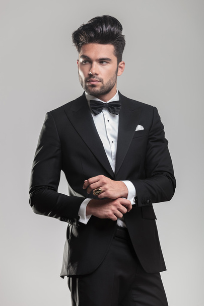 young man wearing a tuxedo, looking away from the camera - Photo, Image