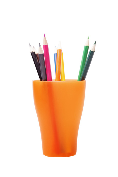 Colored pencils in a orange glass - Valokuva, kuva