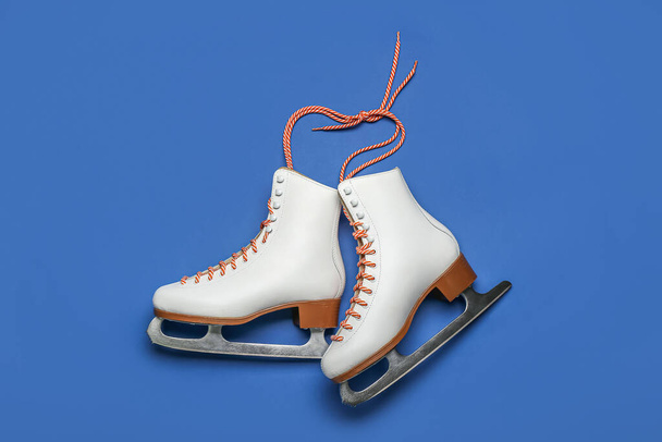 Ice skates on blue background - Photo, Image