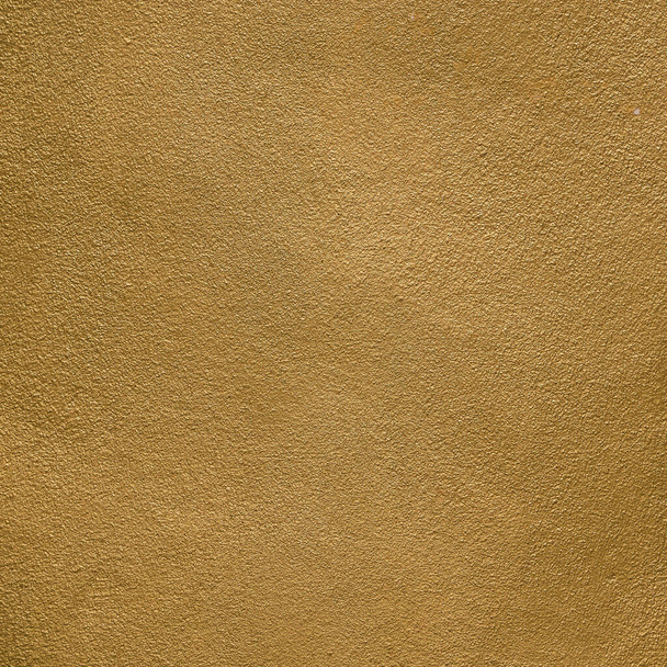 Gold and bronze metal brushed background or texture of concrete wall. golden and bronze chromium noble metal shade concrete wall paint texture. - Photo, Image
