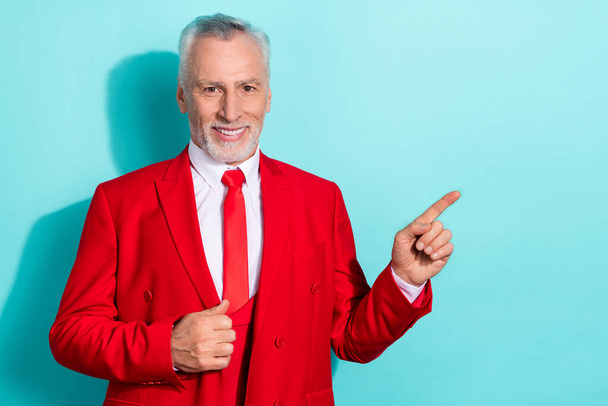 Photo of charming retired man wear red three piece suit pointing empty space isolated turquoise color background - Φωτογραφία, εικόνα