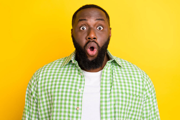 Photo of astonished young guy open mouth stupor confused look camera isolated on yellow color background - Foto, Imagem