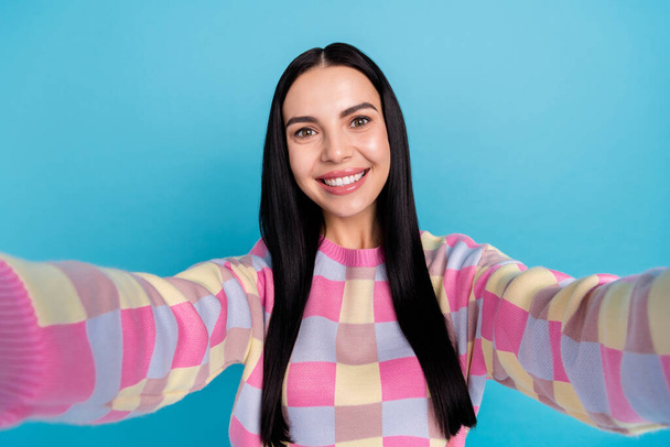 Photo of dreamy charming young woman wear pink sweater tacking selfie isolated blue color background - Fotó, kép
