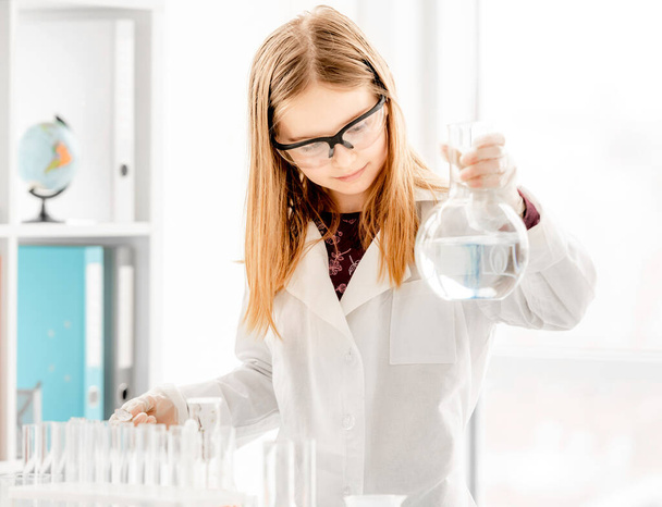 Girl on chemistry lesson - Photo, Image