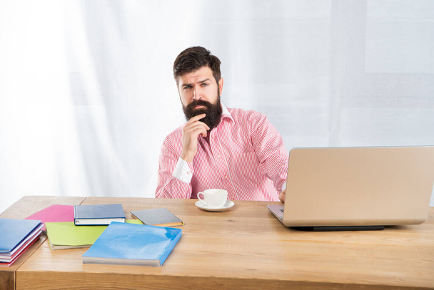 Serious man thinking sitting at office desk. Office work - Foto, Imagem