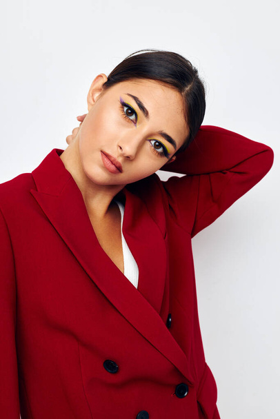 beautiful brunette bright makeup red jacket posing studio model unaltered - Fotó, kép