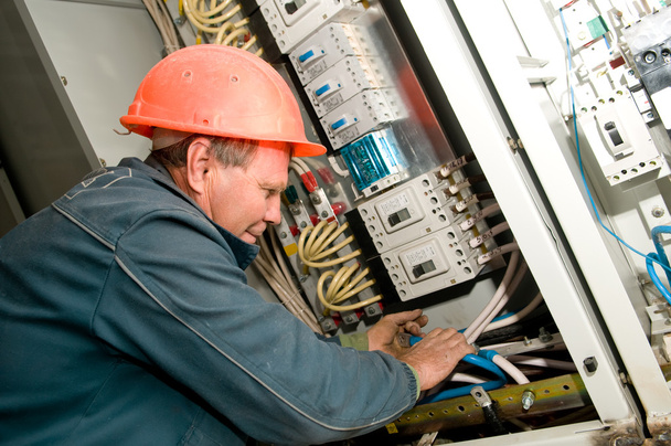 Electrician at installing work - Фото, изображение
