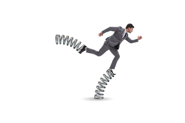 Businessman jumping high on springs - Photo, Image