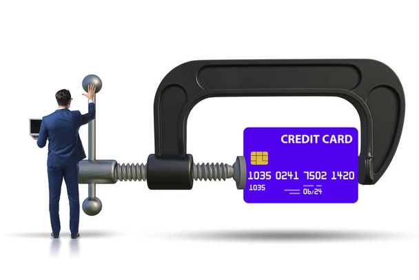 Concept of credit card debt with clamp and businessman - Fotoğraf, Görsel