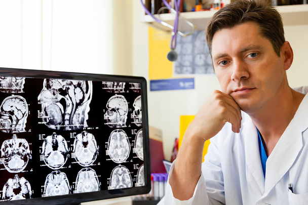 Doctor with MRI scan - Фото, изображение