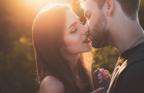 Sensual kissing on sunset. Couple In Love. Intimate relationship and sexual relations. Closeup mouths kissing. Passion and sensual touch. Romantic and love. - Foto, Imagem