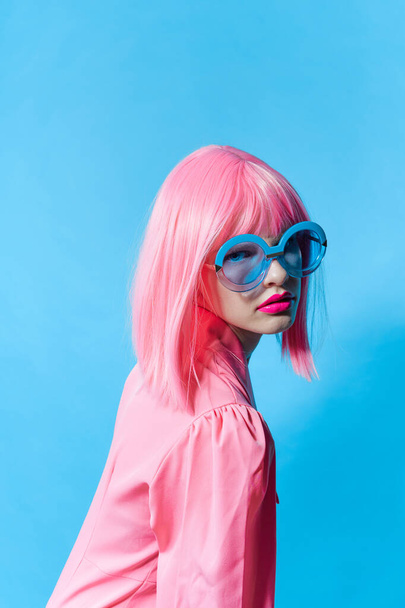 woman in blue glasses wears a pink wig Lifestyle posing - Photo, Image