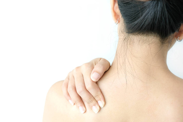 Women have neck pain, shoulder pain, at the park health concept. - Fotoğraf, Görsel