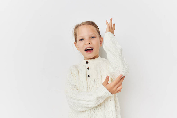 Portrait of happy smiling child girl baby clothes fashion light background - Φωτογραφία, εικόνα