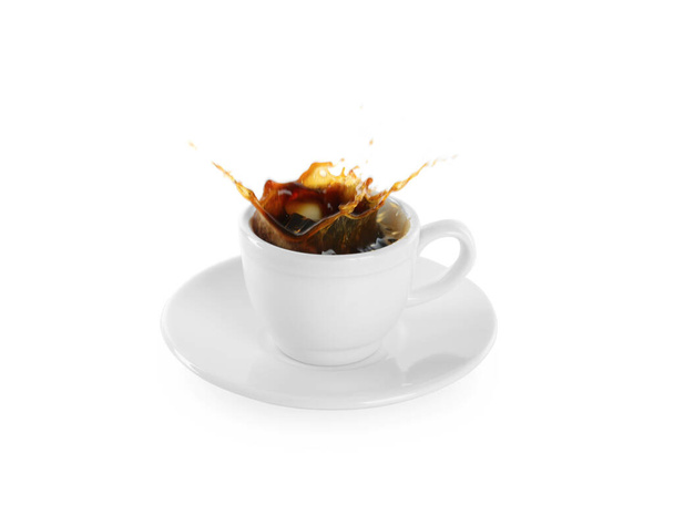 Coffee splashing out of cup on white background - Foto, Imagen