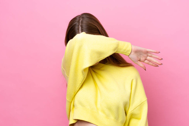 Teenager Russian girl isolated on pink background covering eyes by hands - Fotoğraf, Görsel