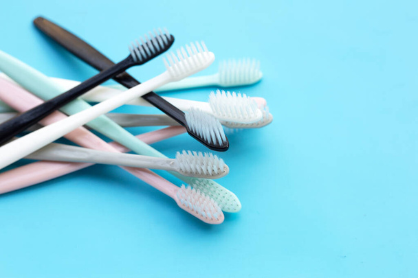 Toothbrushes on blue background.  Copy space - Photo, Image
