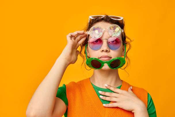 beautiful woman multicolored sunglasses on face posing grimace Lifestyle unaltered - Φωτογραφία, εικόνα