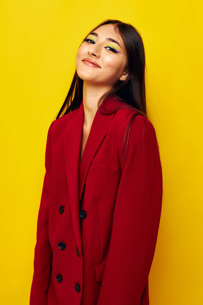 young woman in a red jacket cosmetics smile Lifestyle unaltered - Foto, imagen