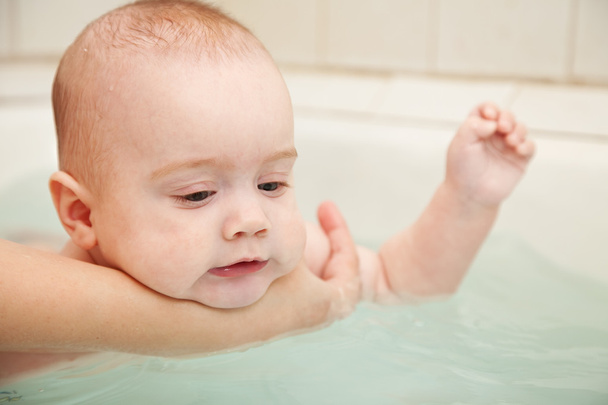 Baby takes bath - Фото, зображення