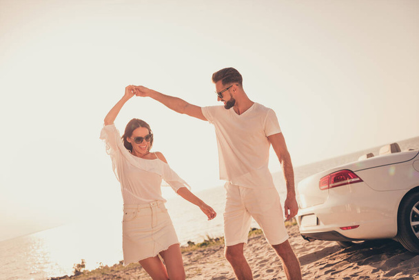 Portrait of attractive cheerful couple spending weekend summertime romance dancing having fun fresh air outdoors - Photo, image