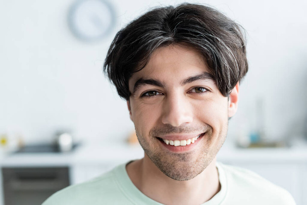 portrait of happy brunette man looking at camera  - Photo, Image