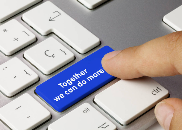 Together we can do more Written on Blue Key of Metallic Keyboard. Finger pressing key. - Photo, Image