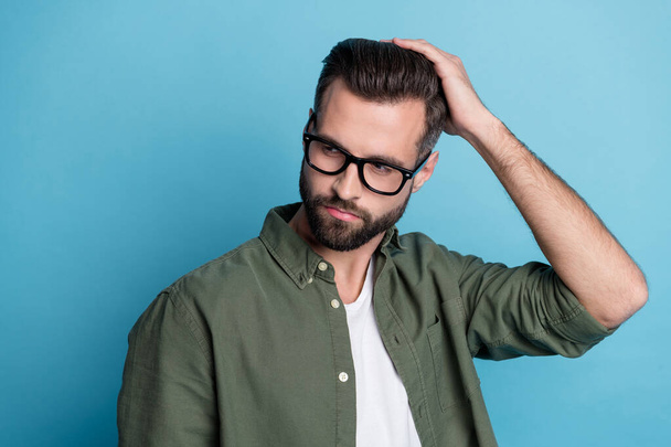Profile photo of intelligent virile cool guy enjoy new haircut wear green shirt isolated blue color background - Foto, imagen