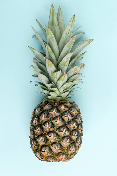 Pineapple on blue background. Top View. Copy Space. minimal style. Creative concept. - Foto, immagini
