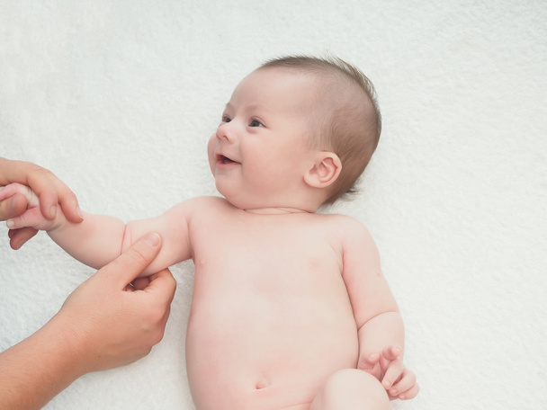 Doctor massage small caucasian baby hand - Photo, Image