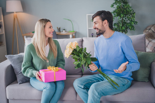 Portrait of two attractive cheerful careful people guy handling giftbox white roses mom day greetings at home indoors - Zdjęcie, obraz