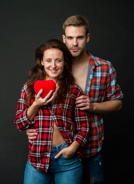 relationship of girl and guy hold heart on black background, relations - 写真・画像