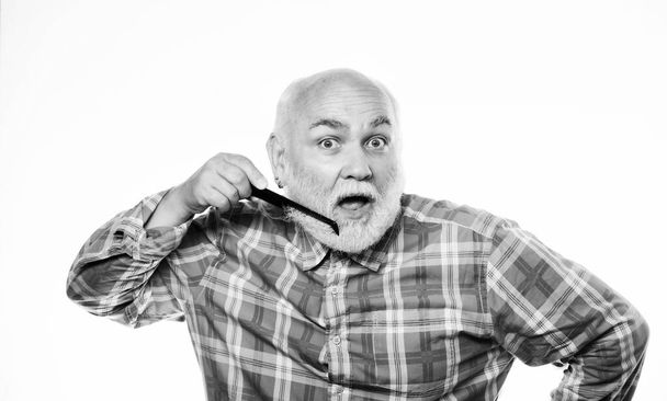 Shaving with fun. mature bearded man isolated on white. barbershop concept. shaving accessories. shaving tool kit. unshaven old man brush moustache and beard. cut and brush hair - Photo, image