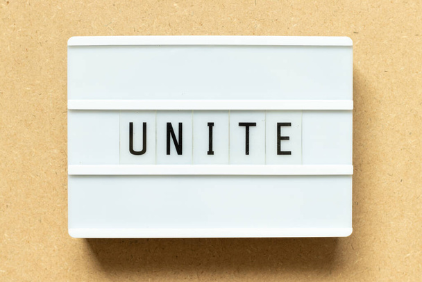 Lightbox with word unite on wood background - Photo, Image