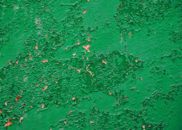 Old green metal background. Uneven surface and texture of rusty metal. - Foto, Imagen