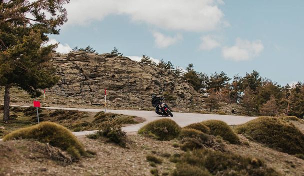 Calar Alto, Spain - May 5th 2021: Man riding a Yamaha XSR700 motorcycle through beautiful landscape, during Dunlop Xperience event in Almeria, Spain. - Foto, Imagem
