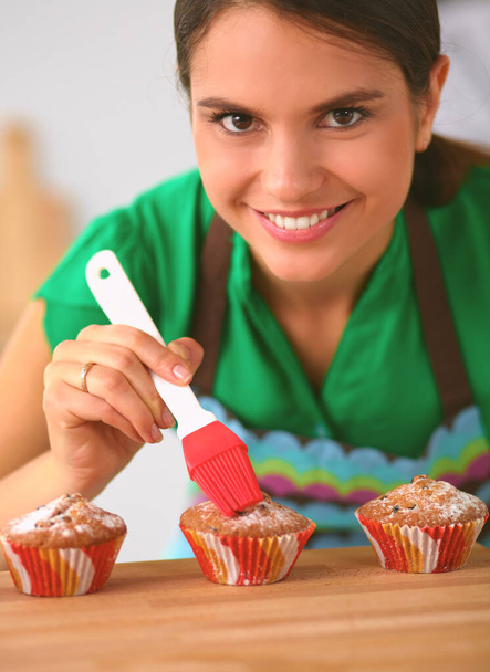Woman is making cakes in the kitchen - Photo, Image