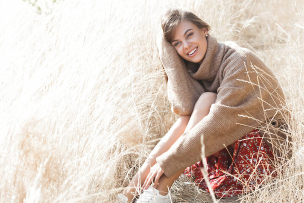 Attractive female. Young woman outdoor. Lady on neutral natural background. Cheerful girl. - Foto, immagini