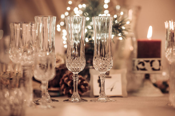 Restaurant table set up. Empty crystal glasses on house dinner table. Restaurant, banquet setting with crystal glasses - Photo, Image