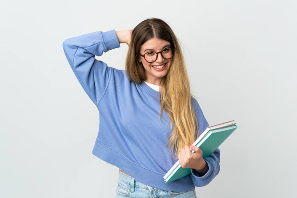 Joven estudiante rubia aislada sobre fondo blanco riendo - Foto, Imagen
