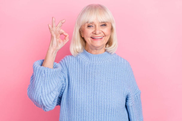Portrait of attractive cheerful grey-haired woman showing ok-sign isolated over pink pastel color background - Photo, image
