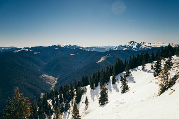 Landscape of snow-capped peaks, late winter early spring - Φωτογραφία, εικόνα