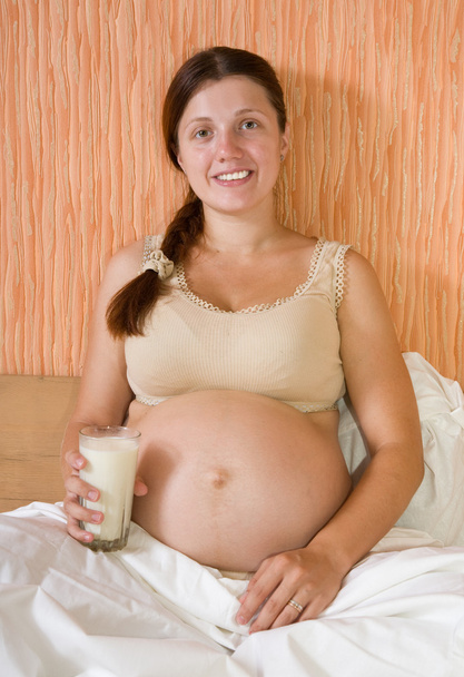 Pregnant woman with glass of milk - Photo, image