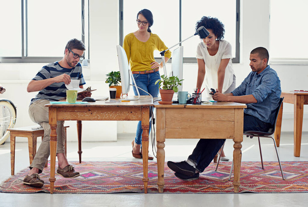 They can design anything. Shot of a group of creative professionals working in an office. - Foto, Imagem