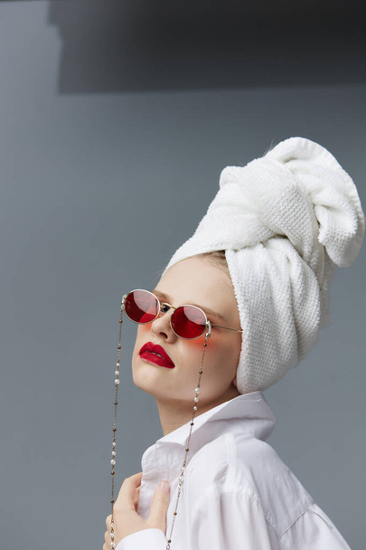 portrait of a woman red glasses towel on head makeup studio model unaltered - Photo, Image