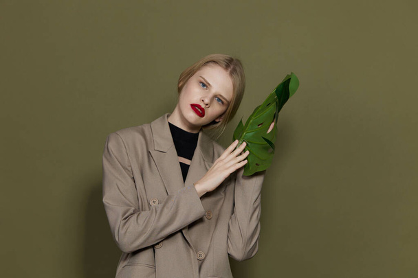 blonde woman red lips palm leaf charm fashion studio model unaltered - Photo, image
