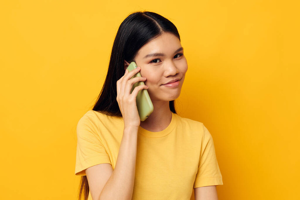 Charming young Asian woman phone communication fun use Lifestyle unaltered - Fotoğraf, Görsel