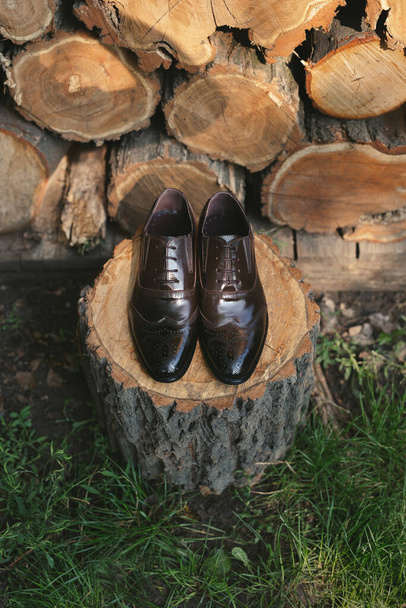 Shoes on a wooden background. Mens accessories. Top view. - Fotó, kép