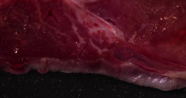 Grilling T born stake meat on the pan in the kitchen close up - Footage, Video