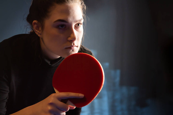 Young girl plays table tennis closeup - Foto, imagen